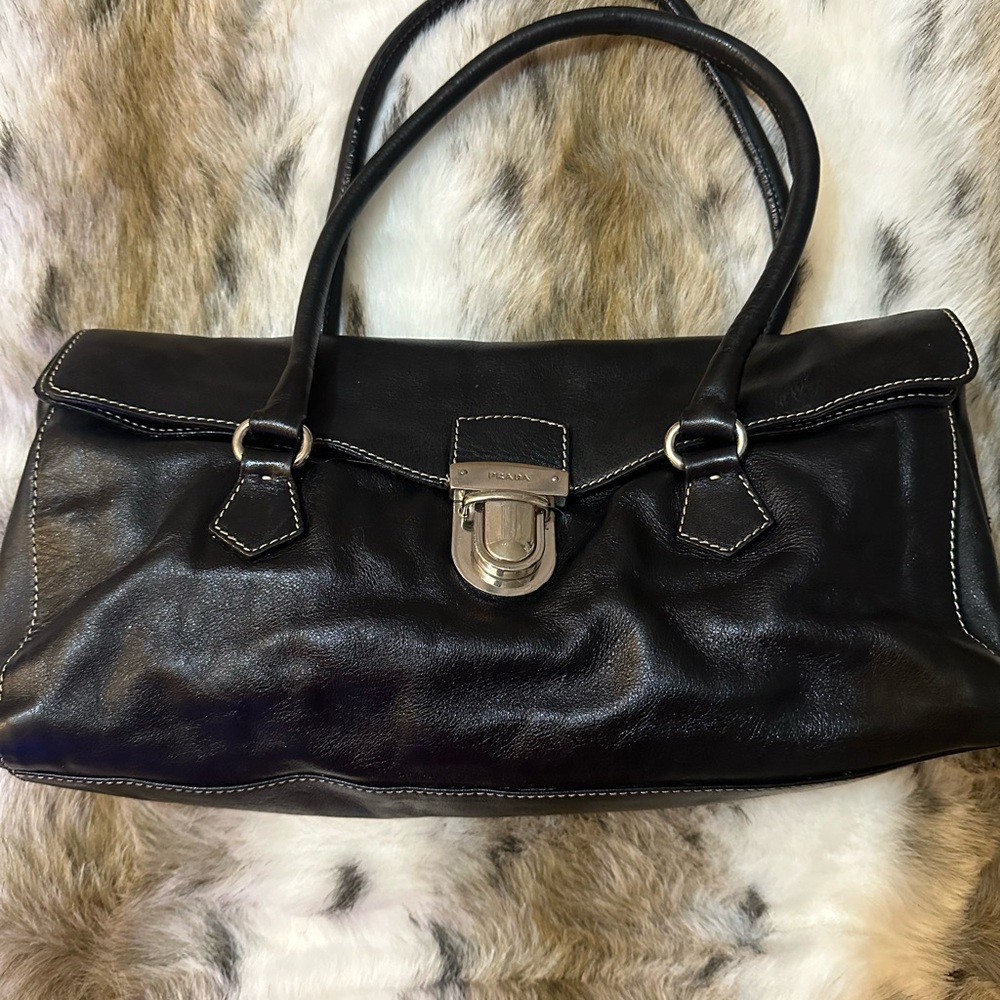 Prada Vitello Easy Foldover Pushlock Satchel in black calfskin leather.